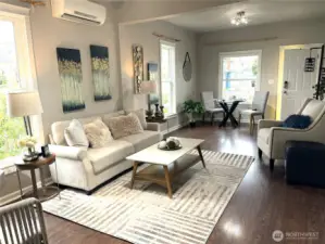 Beautiful open concept living & dining showcases how this home LIVES LARGE with comfort and style.