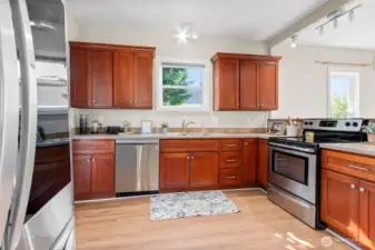 Well-designed kitchen with generous counter space and soft-close cabinetry—style and function in one.