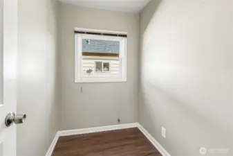 Bright pantry with its own window—ample storage now, endless possibilities for your vision.