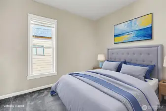 Staged to inspire—see how this primary bedroom transforms into a cozy retreat.