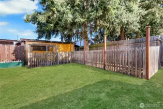 Fenced dog run for your four-legged friends plus raised garden beds ready for fresh plantings.