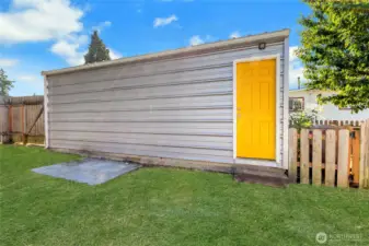 Exterior garage with access from back yard.