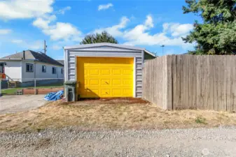 Garage access from alley; door matches front door.