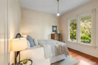 2nd Bedroom overlooking welcoming wraparound porch.