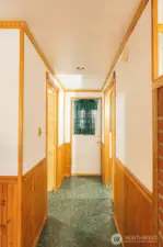 Hallway to laundry and storage room