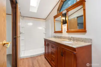 Primary bathroom with large walk-in shower.
