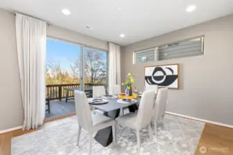 Designated dining area conveniently opens to deck.