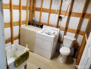 Early pics of bath/laundry room finished. Washer has been replaced with newer model and shower stall has been added to the left of the sink.