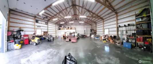 Early wide lens view of shop. Additional storage shelves have been added to the north (left) wall. Picture taken prior to additional belongings being added.