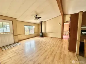 Living room with propane stove and built in shelves