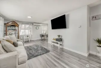 Open-concept living and dining layout with neutral color palette and modern finishes throughout.