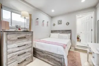 Versatile bedroom suitable for guest room, office, or hobby space.