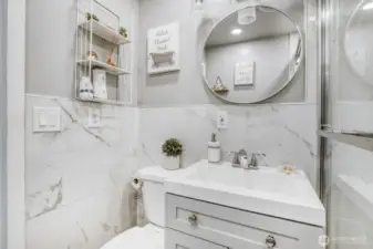 Updated bathroom featuring modern vanity, stylish mirror, and clean contemporary finishes.