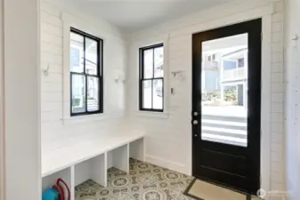 The darling tiled entry is perfect for arriving for your stay.  Lots of storage and durable with the tongue and groove walls.