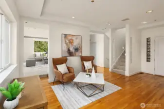 The floorplan is unique but full of potential. This flexible space, as you enter the home, was previously used as a dining area, but works well as a entry/sitting area. Or reimagine and open up the whole first floor to give real wow factor.