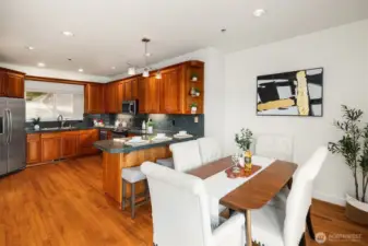 The kitchen area is large, plenty of room for family dining, with sliding doors to the covered deck and incredible views