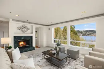 Large living area with picture windows, fill the home with light and it feels like you can almost touch the lake.