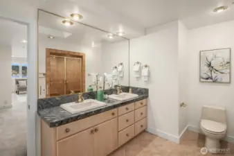 One of two ensuite bathrooms upstairs. Double vanities, huge walk in shower, and a very large second walk-in closet finish off the primary suite bathroom