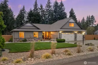 Large grass area in backyard backs up to nature preserve.