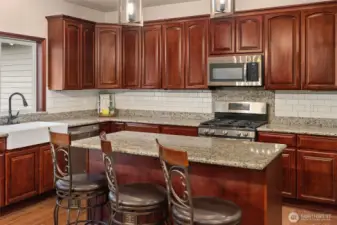 SS appliances, granite countertops.