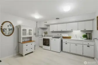 Downstairs utility room is prime for being a second kitchen and setting up a lower level apartment