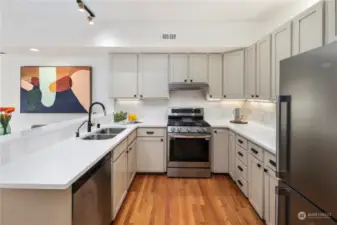 Upgraded kitchen with quartz countertops, all new stainless appliances.