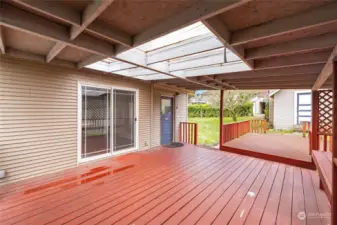 Covered deck off of kicthen for easy outdoor meals.