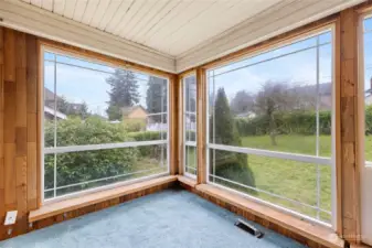 Back of home sunroom overlooks expansive oversized lot. A rare find in north Tacoma.