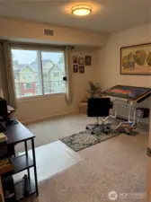 Spare bedroom is set up as hobby/office space.