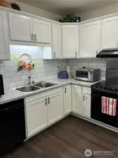 Tile back wall, double sink, great lightening.