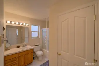 Main floor full bathroom with stackable laundry