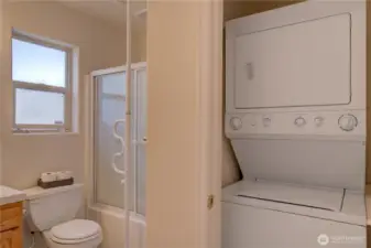 Main floor full bathroom with stackable laundry