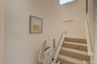 Stairway to the upper level complete with stair lift system.