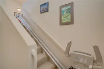 Stairway to the upper level complete with stair lift system.
