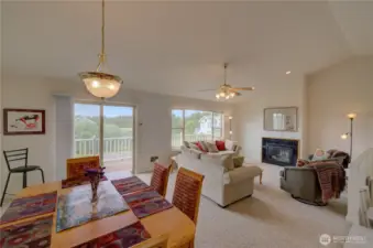 Upper level dining and living area. Sliding door goes to the North facing deck with ocean view. This condo is fully furnished and move in ready.