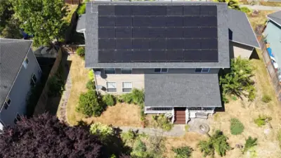 View of roof-mounted Solar PV panels. Provide energy & LOW utility bills.