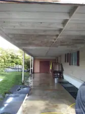 Two car carport with storage at the end.