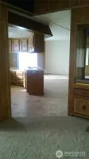 Old layout of living area towards kitchen.