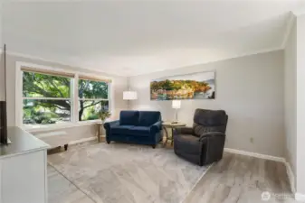 The livingroom provides a quiet space to enjoy the territorial view to your lovely front yard