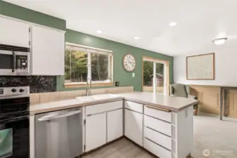 Kitchen with Stainless Steel Appliances and Eating Space
