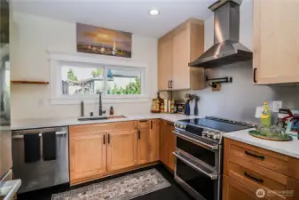 New kitchen with Bosch appliances, double oven, pot filler faucet.