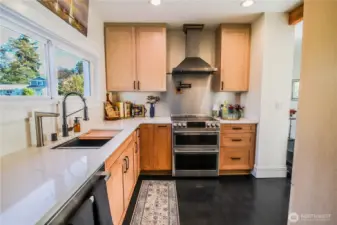 Wave-activated water saving faucet and on-demand hot water, built-in water filtration.