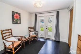 Main floor bedroom could also serve as office or guest room, has French doors to back deck.