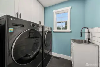 Laundry room with washer and dryer included