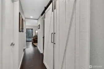 Light and bright front hallway leads to living area.