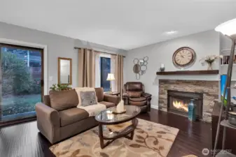 Large windows expose the outdoors and bring natural light into the room.