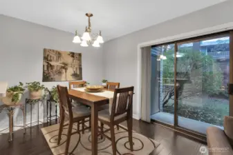 The dining area allows for a suitable table and chairs for your everyday meals. A sliding door provides easy access to the outdoors and gives a more open and airier feel to the space.
