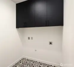 Laundry room with built-in cabinets