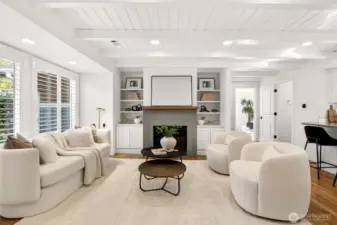 Custom built in bookshelves and hand poured concrete gas fireplace surround