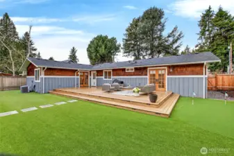 Backyard with $100k of remodels including trex deck, landscaping, artificial turf  and putting green
